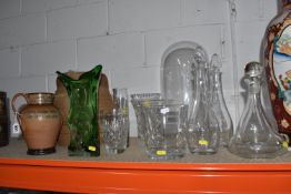 A GROUP OF GLASS AND STONEWARE ITEMS comprising a large glass dome, height of approximately 42cm (