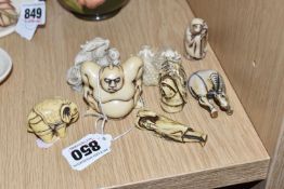 A GROUP OF EIGHT MODERN RESIN JAPANESE NETSUKE-STYLE FIGURINES to include two Victorian and Albert