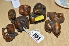 A GROUP OF EIGHT WOODEN MODERN NETSUKE FIGURINES to include an octopus, a horse, a curled mouse, a