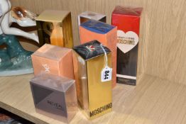 A GROUP OF SEVEN BOXED PERFUMES AND CREAMS to include an unopened 'Chloe Parfums Lagerfeld Paris'