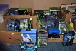 FOUR BOXES OF GAMING CONTROLLERS AND HEADSETS, all are third party, some are boxed but some are not,