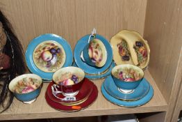 A GROUP OF FOUR AYNSLEY 'ORCHARD GOLD' TRIOS AND A SECTIONED DISH comprising four trios to include