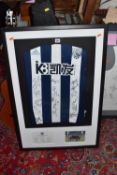 A SIGNED WEST BROMWICH ALBION FOOTBALL SHIRT from Adidas with sixteen signatures from players of the