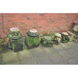 A COLLECTION OF SANDSTONE ARCHITECTURAL COLUMN PARTS including two bases and three tops with