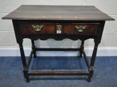 A GEORGIAN OAK LOWBOY, with a single frieze drawer, raised on turned legs, united by stretchers,