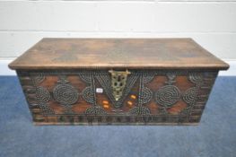 A BRASS-STUDDED HARDWOOD ZANZIBAR CHEST, with twin brass handles, the hinged lid enclosing a