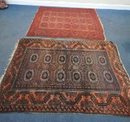 A RED GROUND RECTANGULAR AFGHAN RUG, with twenty-one central medallions, surrounded by a multi-strap