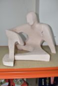 A LARGE CLAY SCULPTURE OF A SEATED MALE in an abstracted form, sculpted from a rough clay,