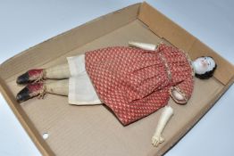 A NINETEENTH CENTURY PORCELAIN HEAD DOLL, with hand stitched cloth body and legs, kid leather arms