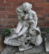 A CONCRETE GARDEN FIGURE, in the form of a seated lady holding a sea shell and a swan, height