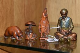 A PAINTED SPELTER FIGURE, TWO NETSUKE AND A WOODEN FIGURE, comprising a painted spelter figure of