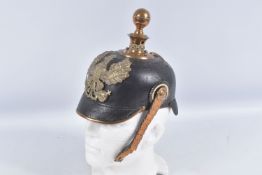 A PRUSSIAN ARTILLERY PICKLEHAUBE/ KUGELHELME HELMET, with a rounded ball shape top and the front has