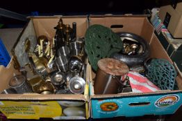 TWO BOXES OF ASSORTED METALWARES to include a cast iron recipe stand, two green trivets, a group