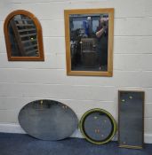 A MODERN RECTANGULAR WALL MIRROR, 89cm x 64cm, an oval wall mirror, an Ikea tyre mirror, along