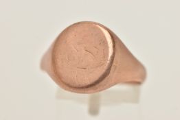 A 9CT ROSE GOLD GENTS SIGNET RING, of an oval form with worn engraving, polished split band will