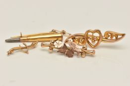 FOUR YELLOW METAL BROOCHES, the first a yellow metal open work heart with scrolling detail,