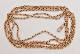 A YELLOW METAL LONGUARD CHAIN, an elongated belcher link chain, fitted with a lobster clasp,