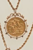 A MOUNTED FULL GOLD SOVEREIGN COIN PENDANT AND CHAIN, the sovereign depicting King George V, dated
