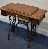 A SINGER TREADLE SEWING MACHINE, with the brass plate reading Y5599302 and electrical fitting, width
