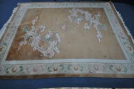 IMPERIAL JEWEL, A LARGE RECTANGULAR BROWN GROUND CHINESE WOOLLEN RUG, depicting two dragons,