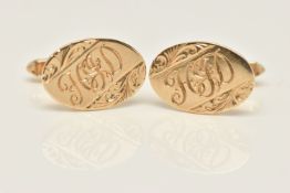 A PAIR OF 9CT GOLD CUFFLINKS, each of an oval form with floral pattern and engraved initials, toggle