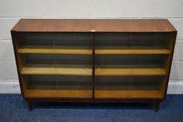 A MEREDEW TEAK TWIN SECTION GLAZED BOOKCASE, with adjustable shelves, width 134cm x depth 33cm x