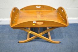 A YEW WOOD BUTLERS TRAY TABLE, with fold down sides, raised on a folding frame, width 79cm x depth