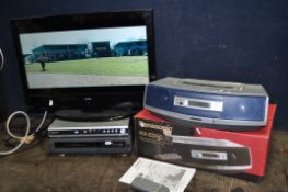 AN ALBA 26in TV, a Sanyo DVD player, a Hitachi VHS recorder and a boxed Panasonic portable hi fi