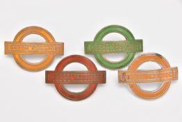 FOUR ENAMELLED 'LONDON TRANSPORT' CAP BADGES, all of roundel type, in red, green and two x amber