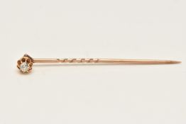 A DIAMOND STICK PIN, a removable screw top stick pin, set with an old cut diamond, estimated diamond