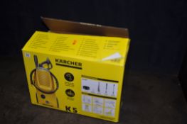 A KARCHER K5 CLASSIC PRESSURE WASHER, box opened but appears new, along with two hoses (3)