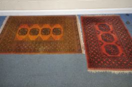 TWO RECTANGULAR AFGHAN RUGS, largest rug highly discoloured so cannot guarantee the original colour,