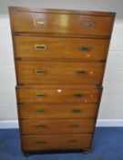 AN EARLY 20TH CENTURY MAHOGANY CAMPAIGN CHEST ON CHEST, fitted with seven drawers each tier with
