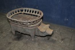 AN EARLY 20th CENTURY NOVELTY CAST IRON MINIATURE FIRE PIT / BARBECUE, in the form of a pig, with an