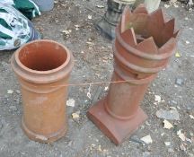 TWO TERRACOTTA CHIMNEYS POTS, one with spikes to the top, largest height 92cm, condition report: one