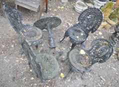 A CAST IRON CIRCULAR TABLE, with a shaped support, on a tripod base, diameter 60cm, along with three