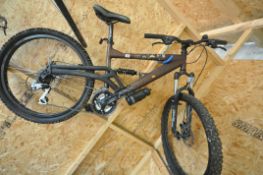 A SARACEN RAW 7005 MOUNTAIN BIKE, with an 18 inch frame, Shimano breaks and gears, condition report: