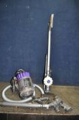 A DYSON DC32 VACUUM CLEANER, and a V6 Flexi cordless vacuum (battery integrity unknown) with power