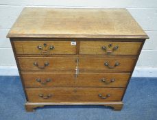 AN EARLY 20TH CENTURY OAK CHEST OF TWO SHORT OVER THREE LONG GRADUATED DRAWERS, raised on bracket