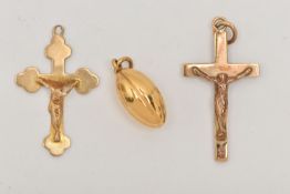 TWO 9CT GOLD CRUCIFIX PENDANTS AND A CHARM, the pendants both hallmarked 9ct Birmingham and