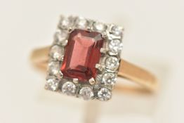 A 9CT GOLD GARNET AND CUBIC ZIRCONIA CLUSTER RING, of a rectangular form, polished band,