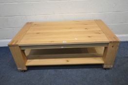 A MODERN SOLID OAK RECTANGULAR TWO TIER COFFEE TABLE, width 131cm x depth 65cm x height 51cm,