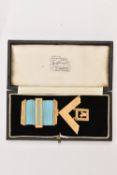 A 9CT GOLD MASONIC MEDAL, a yellow gold floral etched medal with a blue ribbon, engraved '