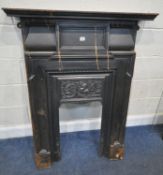 A CAST IRON FIRE SURROUND, with a central foliate plaque, width 91cm x depth 16cm x height 124cm,