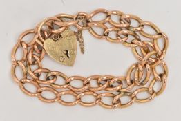 A 9CT GOLD BRACELET, a yellow gold double curb link chain, hallmarked 9ct Birmingham, each link