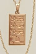 A 9CT GOLD INGOT PENDANT, a yellow gold rectangular form pendant with three lions motif,