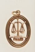 A 9CT GOLD 'LIBRA' PENDANT, of an oval open work form, fitted with a jump ring for suspension,
