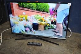 A SAMSUNG UE32J6100 32in TV with remote (PAT pass and working)