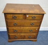 A REPRODUCTION SOLID OAK CHEST OF TWO SHORT OVER THREE LONG DRAWERS, raised on bracket feet, width