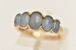 A 9CT GOLD OPAL TRIPLET RING, five graduated opal triplets, collet set to the polished band,